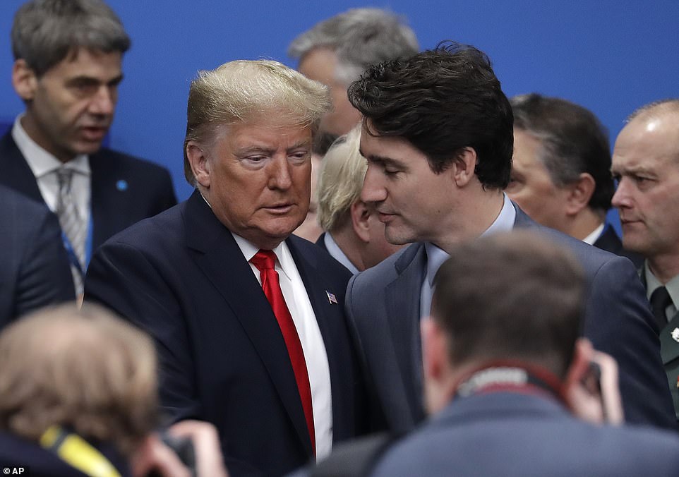 A tense meeting between Donald Trump and Justin Trudeau was captured on camera at the NATO summit in Watford, Hertfordshire today after Trump was questioned by reporters about Trudeau's comments caught on a hot mic yesterday