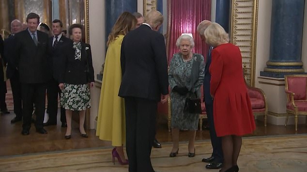 President and Mrs Trump poke to the Queen, Charles and Camilla before making their way inside. Princess Anne waited her turn and remained in the doorway, as seen above