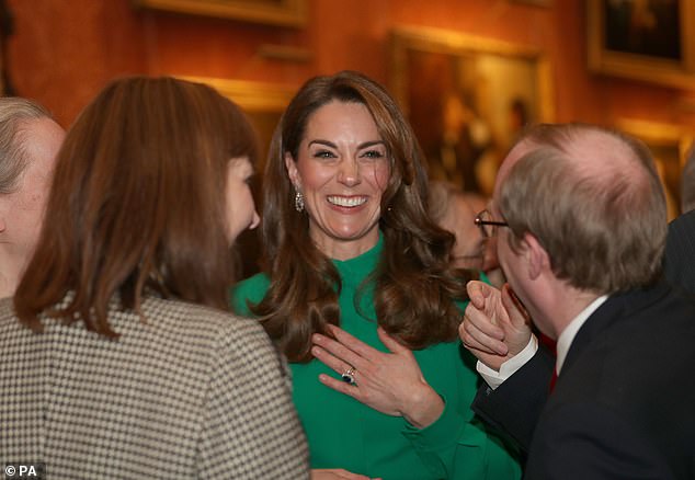 Kate Middleton (above) looked stunning this evening as she wore a green dress and wore her hair in loose waves at the reception