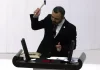 Turkish MP smashes phone with hammer in furious speech over social media law