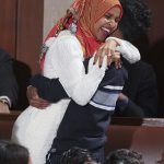 8110296-6555271-Rep_Ilhan_Omar_embraces_her_oldest_son_after_she_was_sworn_by_ne-a-12_1546564342439