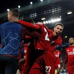 13216104-7002753-Origi_is_swarmed_by_his_Liverpool_team_mates_after_scoring_the_f-a-23_1557264808961