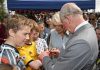 Prince Charles signs boy’s broken arm as he visits farmers’ market in New Zealand with Camilla