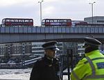 Double decker buses and cars sit abandoned on eerily quiet London Bridge two days after attack