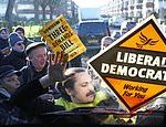 Extinction Rebellion activists dressed as BEES swarm Liberal Democrats’ electric-powered bus