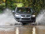 Rain lashes UK as more than 90 flood warnings are in place amid fears over power cuts