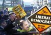 Extinction Rebellion activists dressed as BEES swarm Liberal Democrats’ electric-powered bus